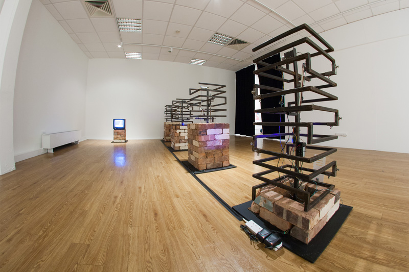 Tomas Penc - Angular Oppressors II, interactive installation, bricks, steel, electronic components, paper, sound, dimensions variable, 2016